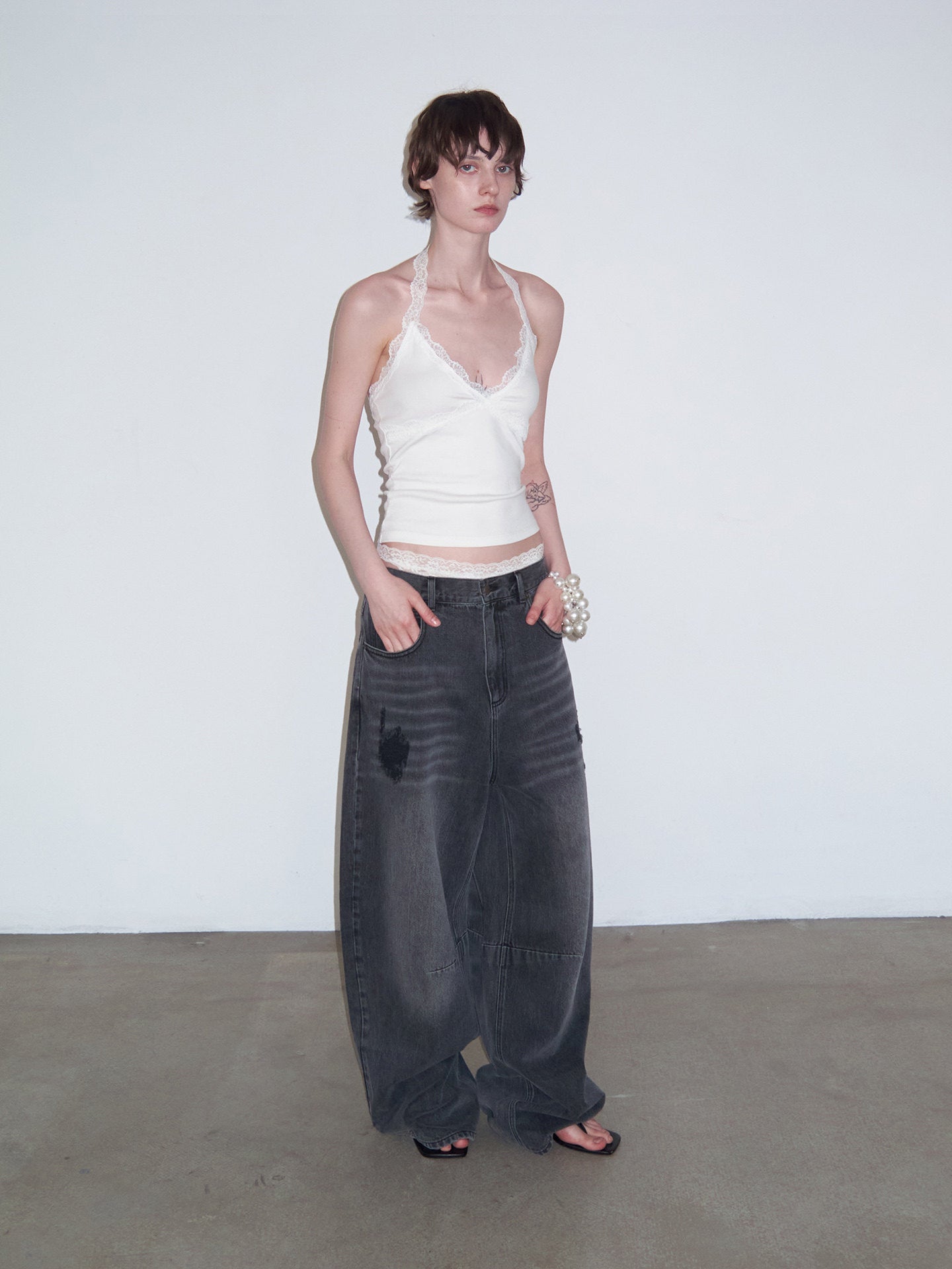 Distressed Patchwork Curved-Cut Denim Pants