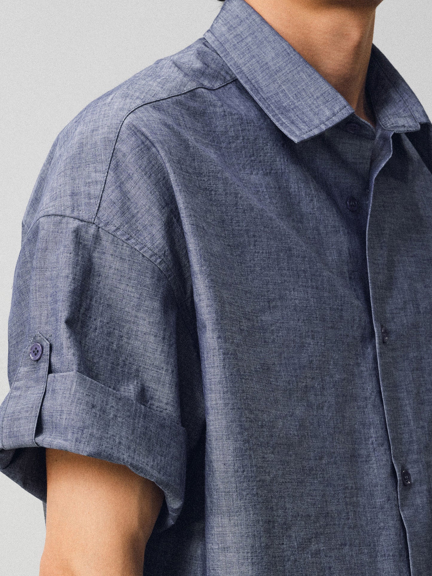 A relaxed-fit shirt with rolled sleeves