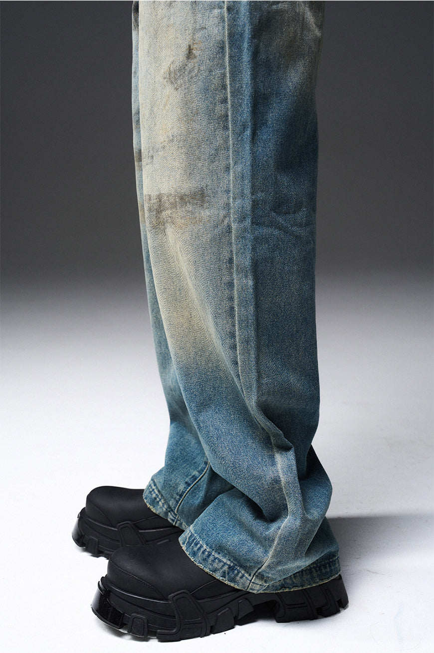 Mud-dyed solid color damaged jeans