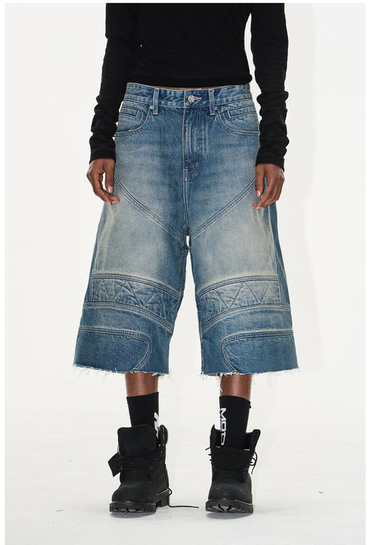 Wash-processed distressed denim shorts