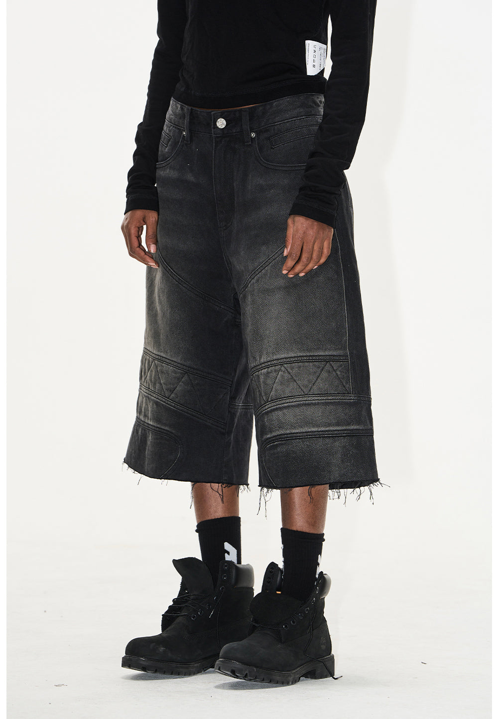 Wash-processed distressed denim shorts