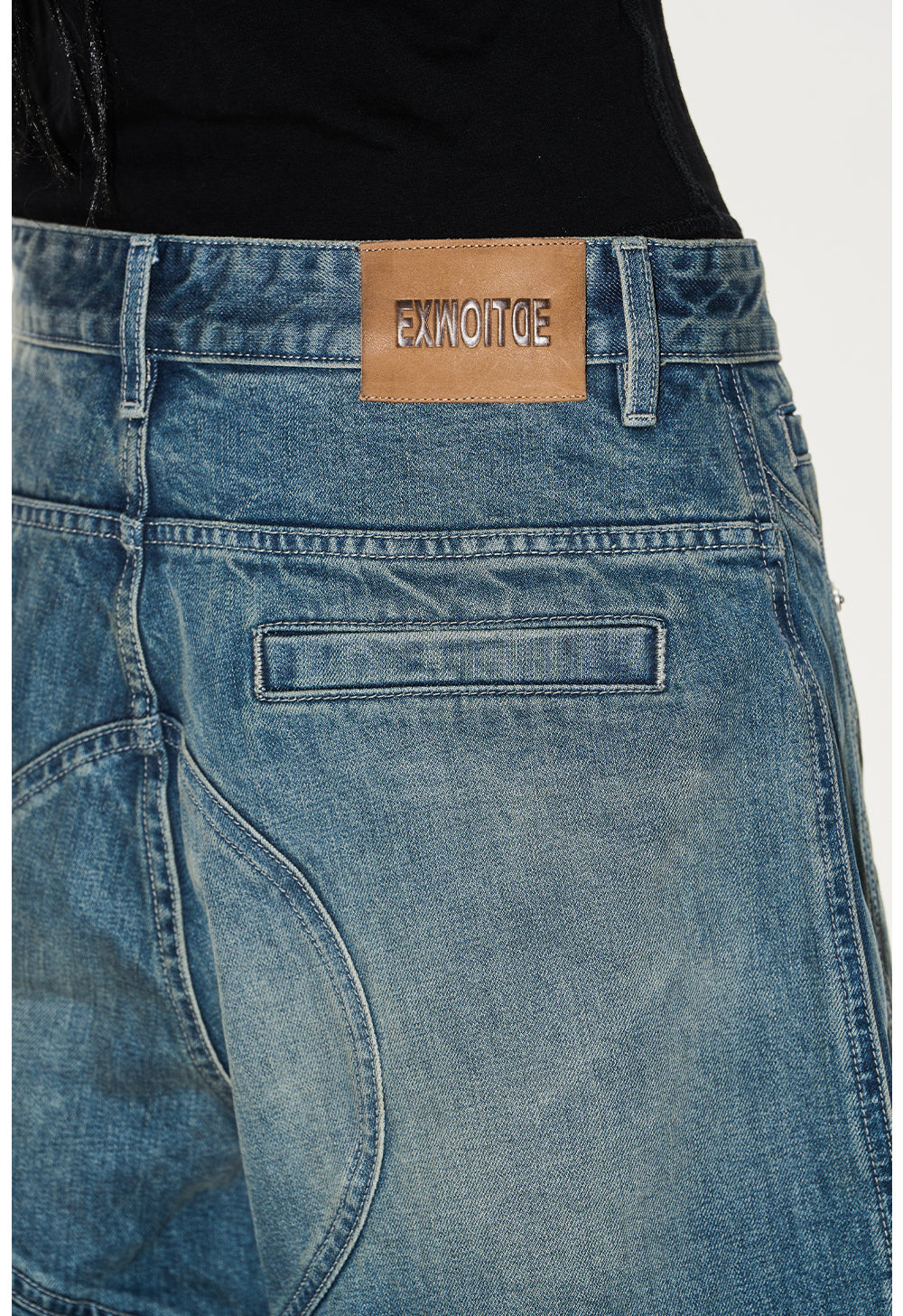 Wash-processed distressed denim shorts