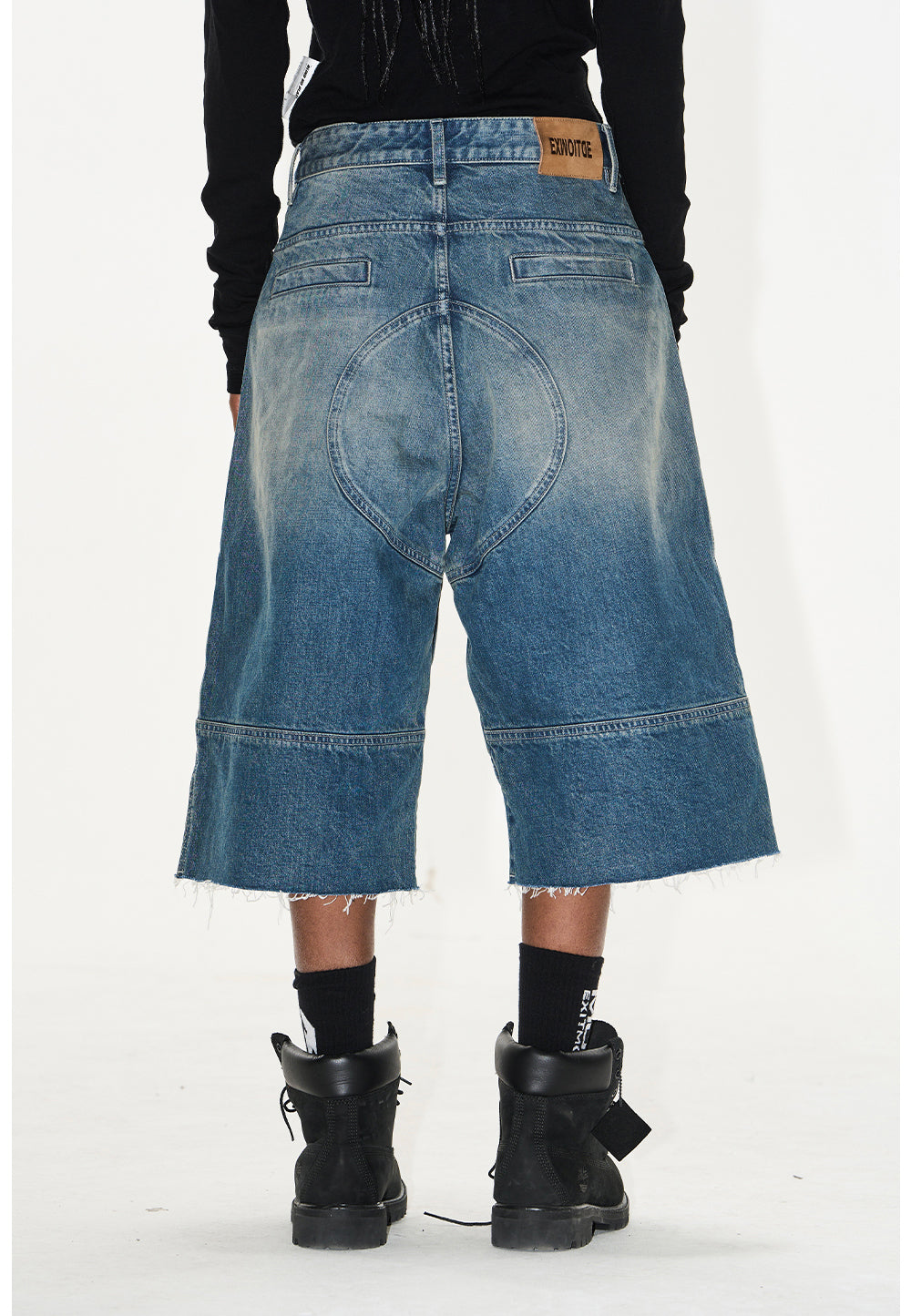 Wash-processed distressed denim shorts