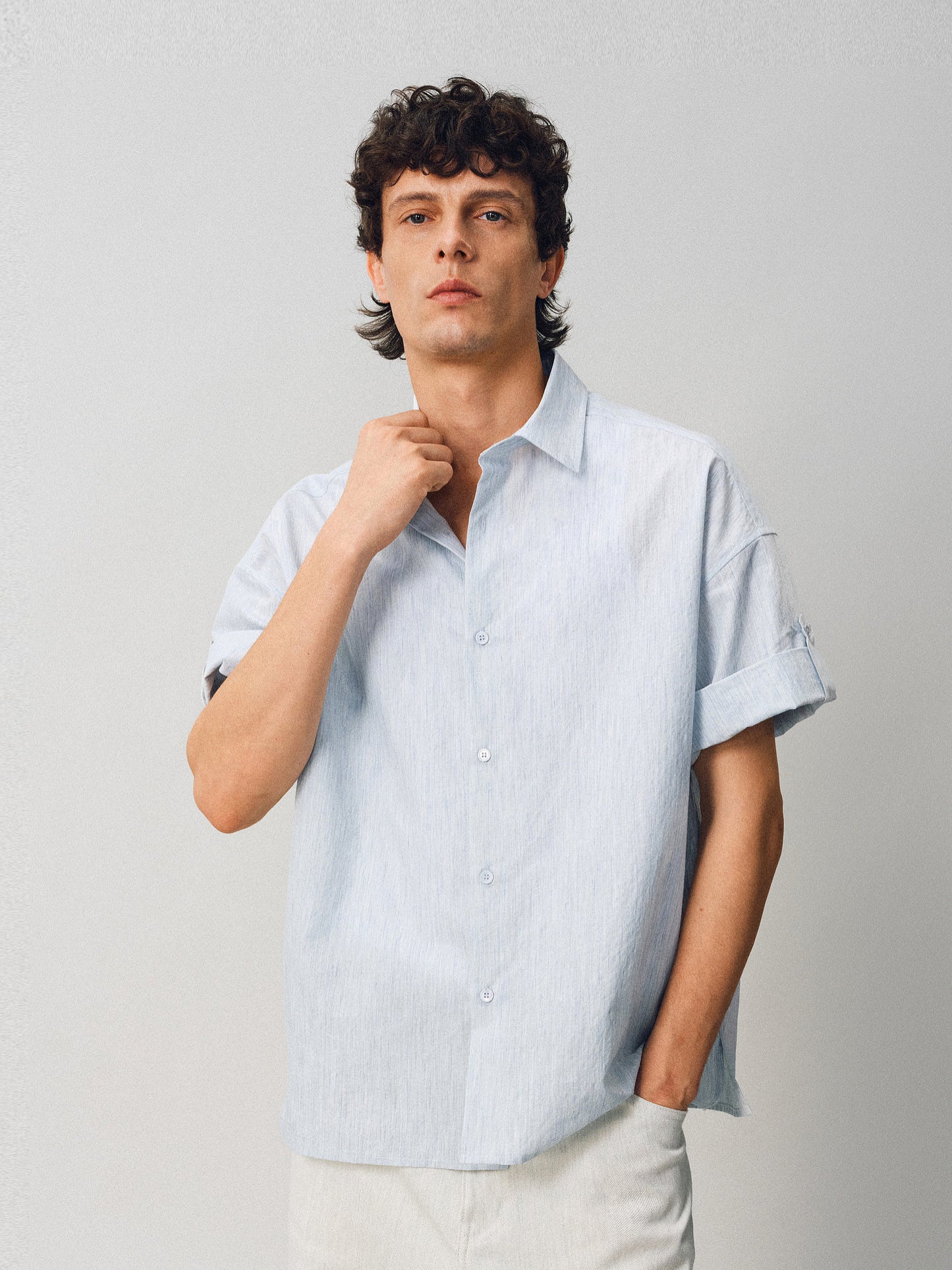 A relaxed-fit shirt with rolled sleeves