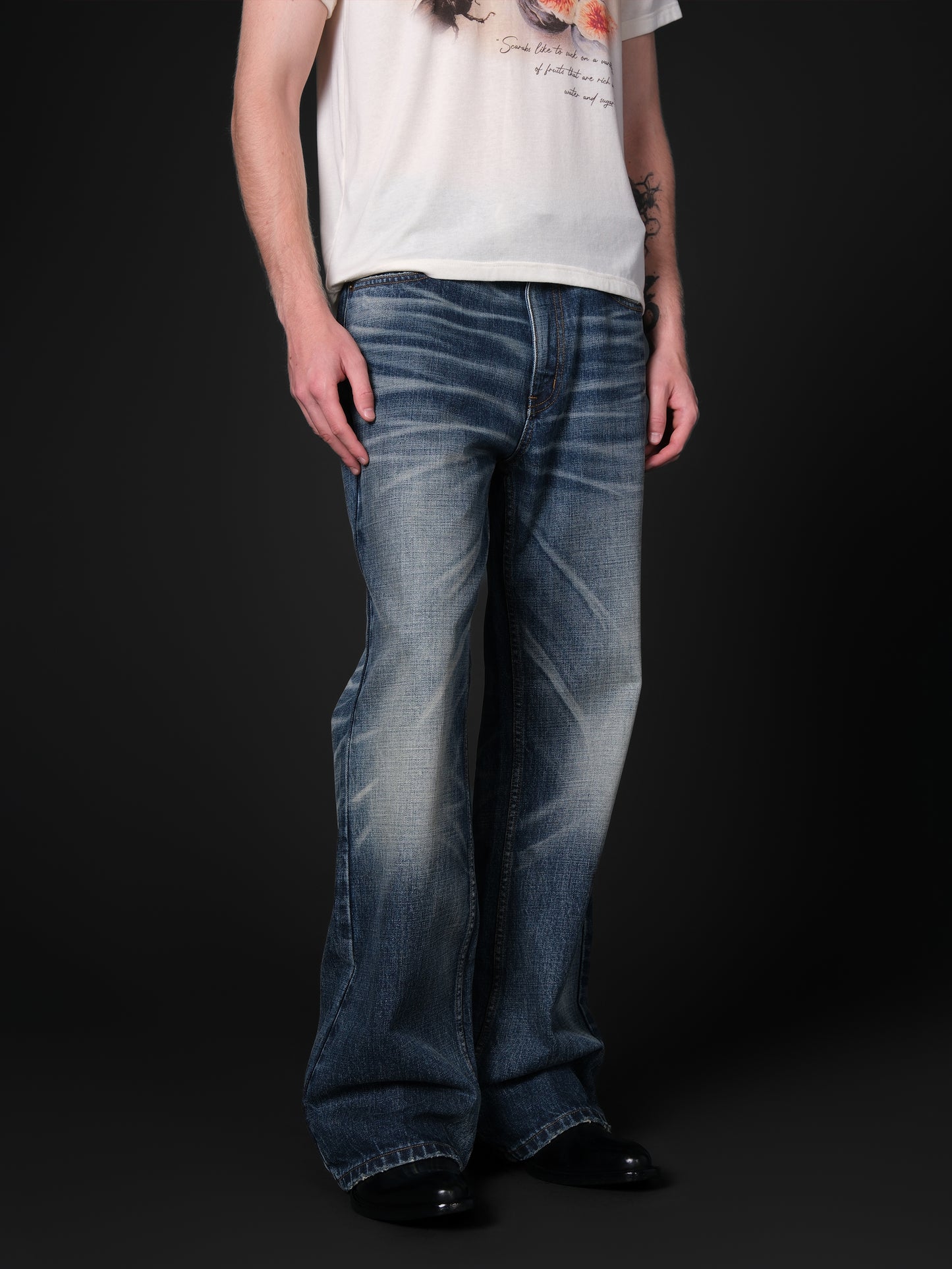 Washed distressed flared jeans