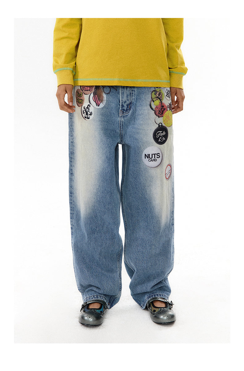 Medal print denim pants