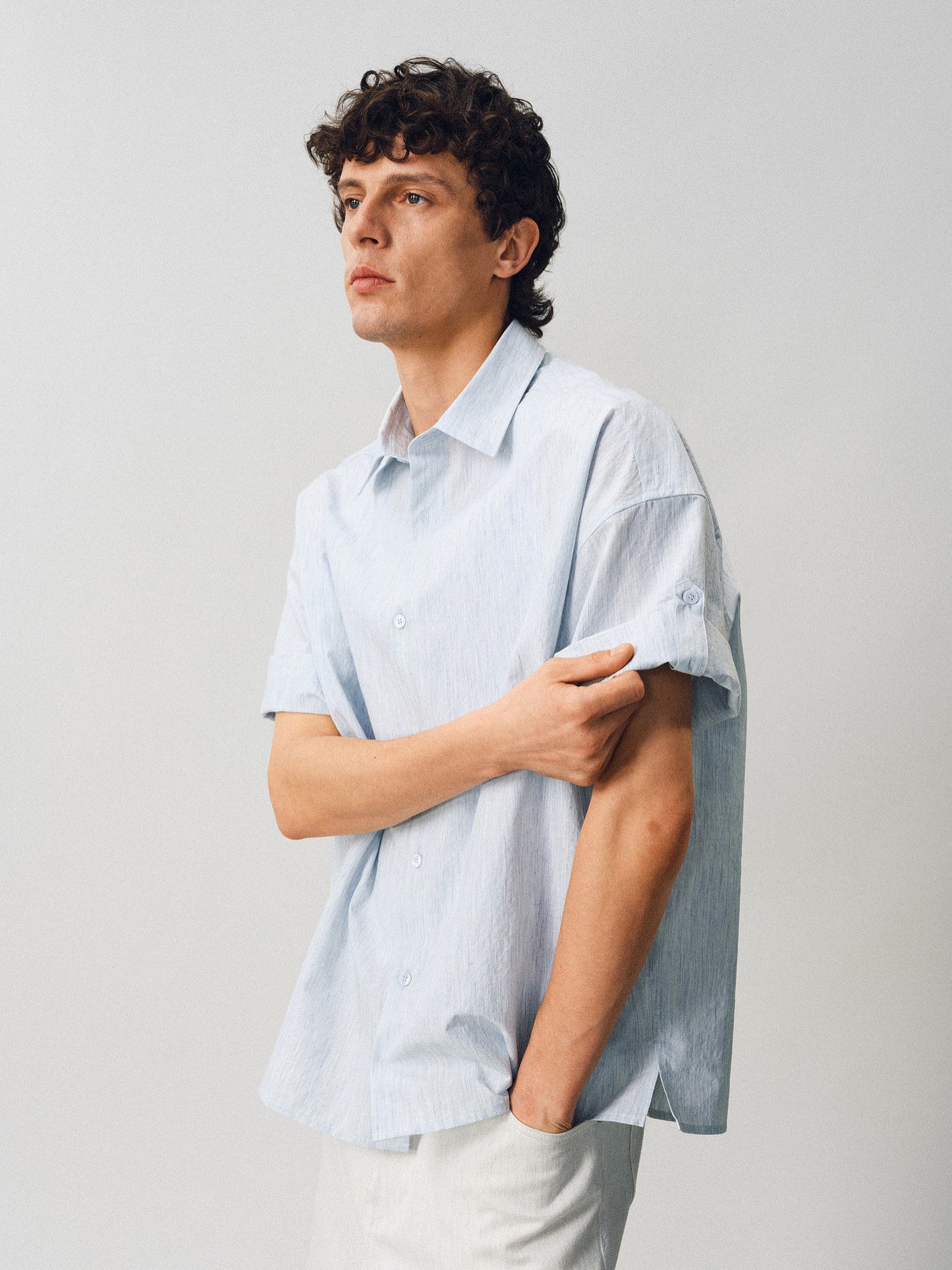 A relaxed-fit shirt with rolled sleeves