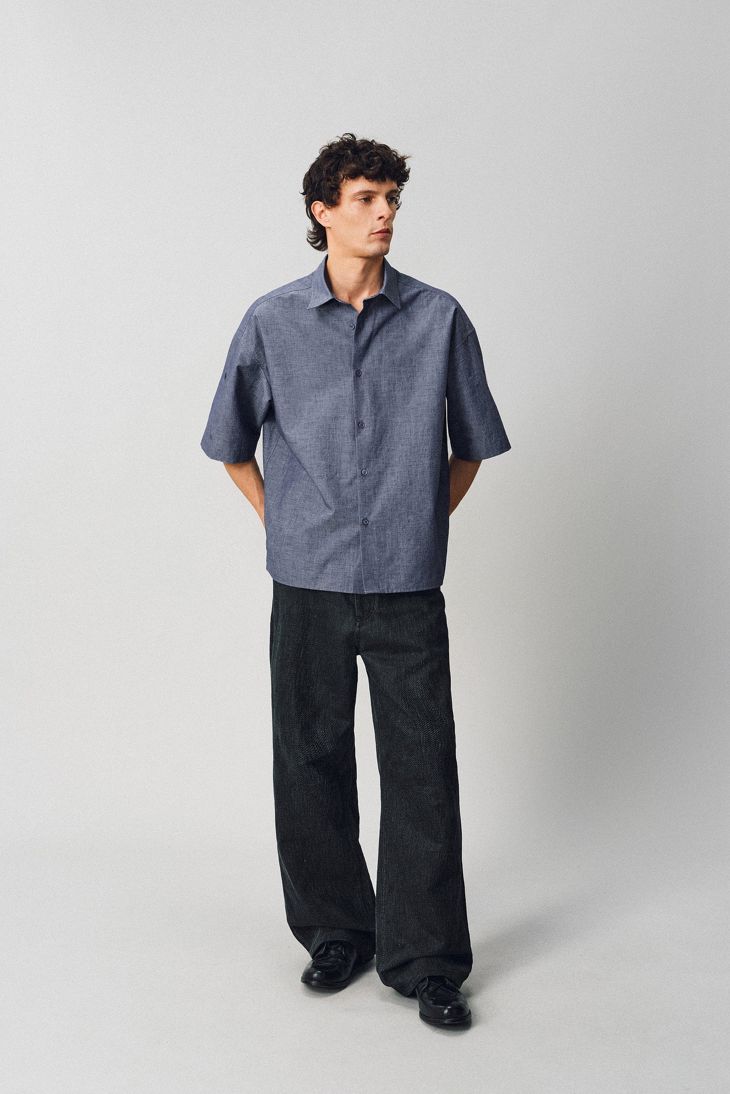 A relaxed-fit shirt with rolled sleeves