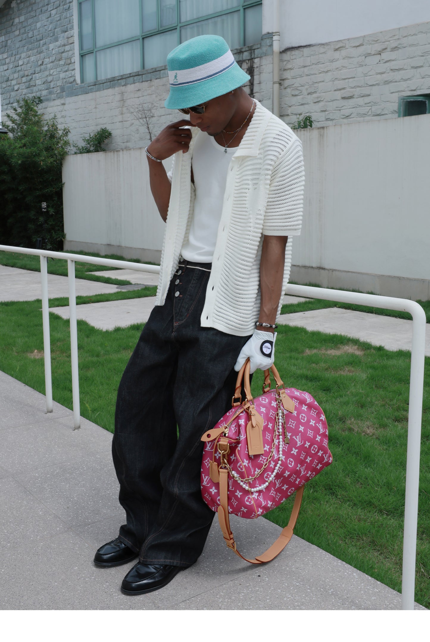 Denim pants with diagonal buckles