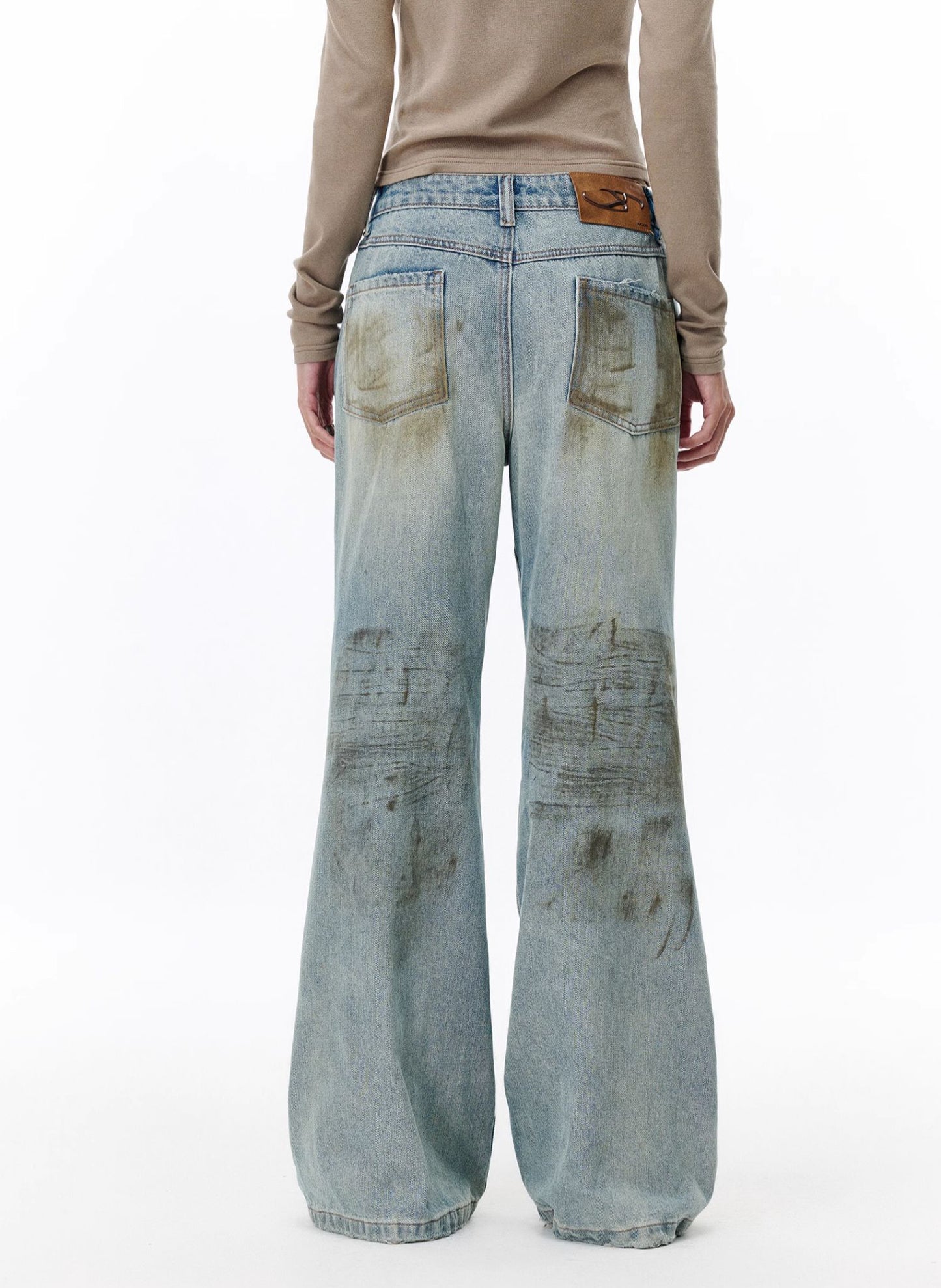 Mud-dyed dirty fit jeans