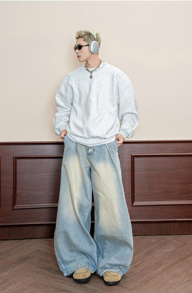 Street-washed pleated jeans