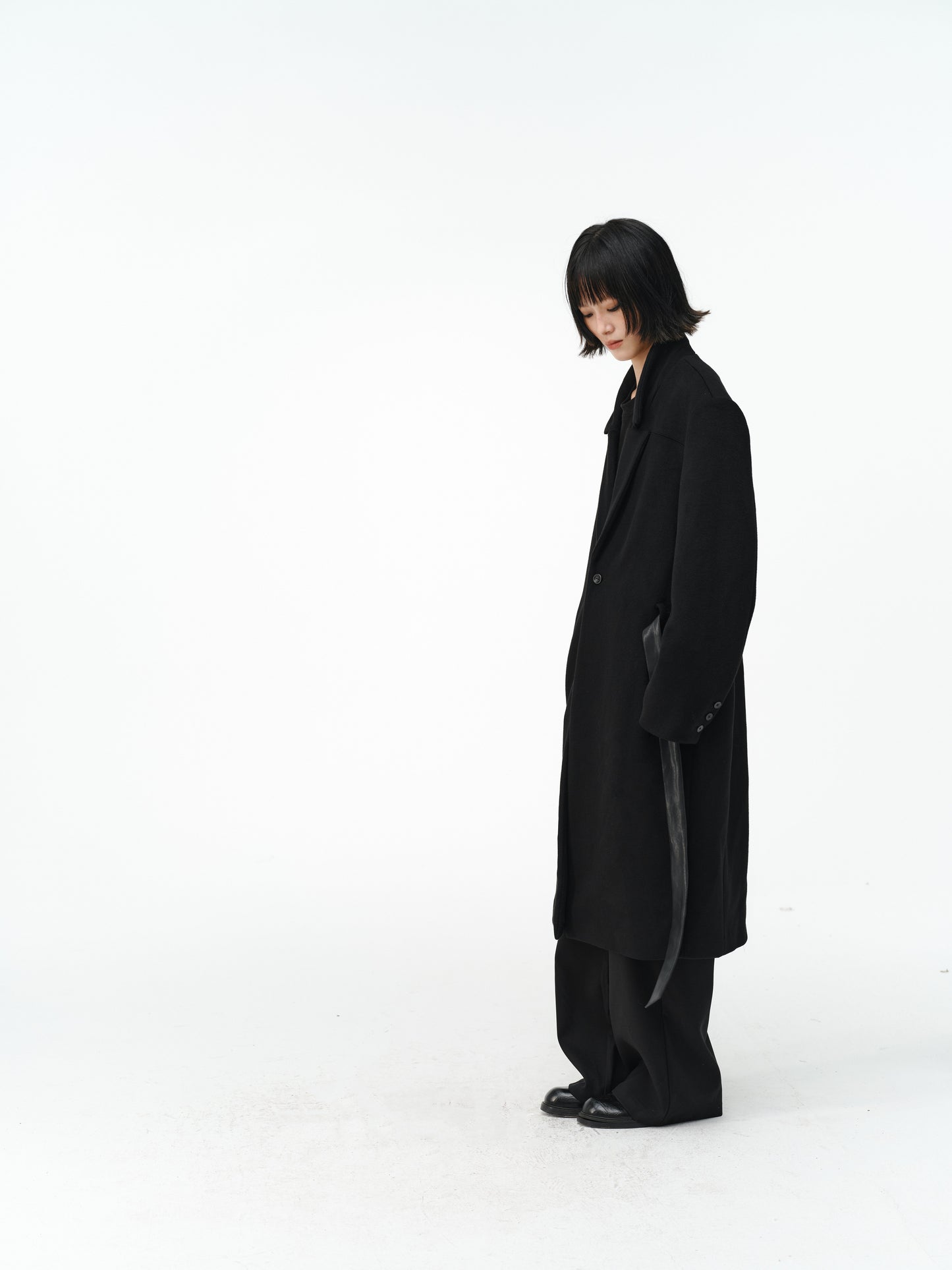 Overcoat with a leather belt