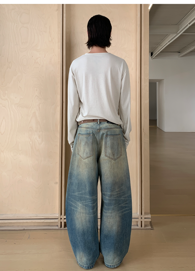 Mud-dyed wide-leg jeans