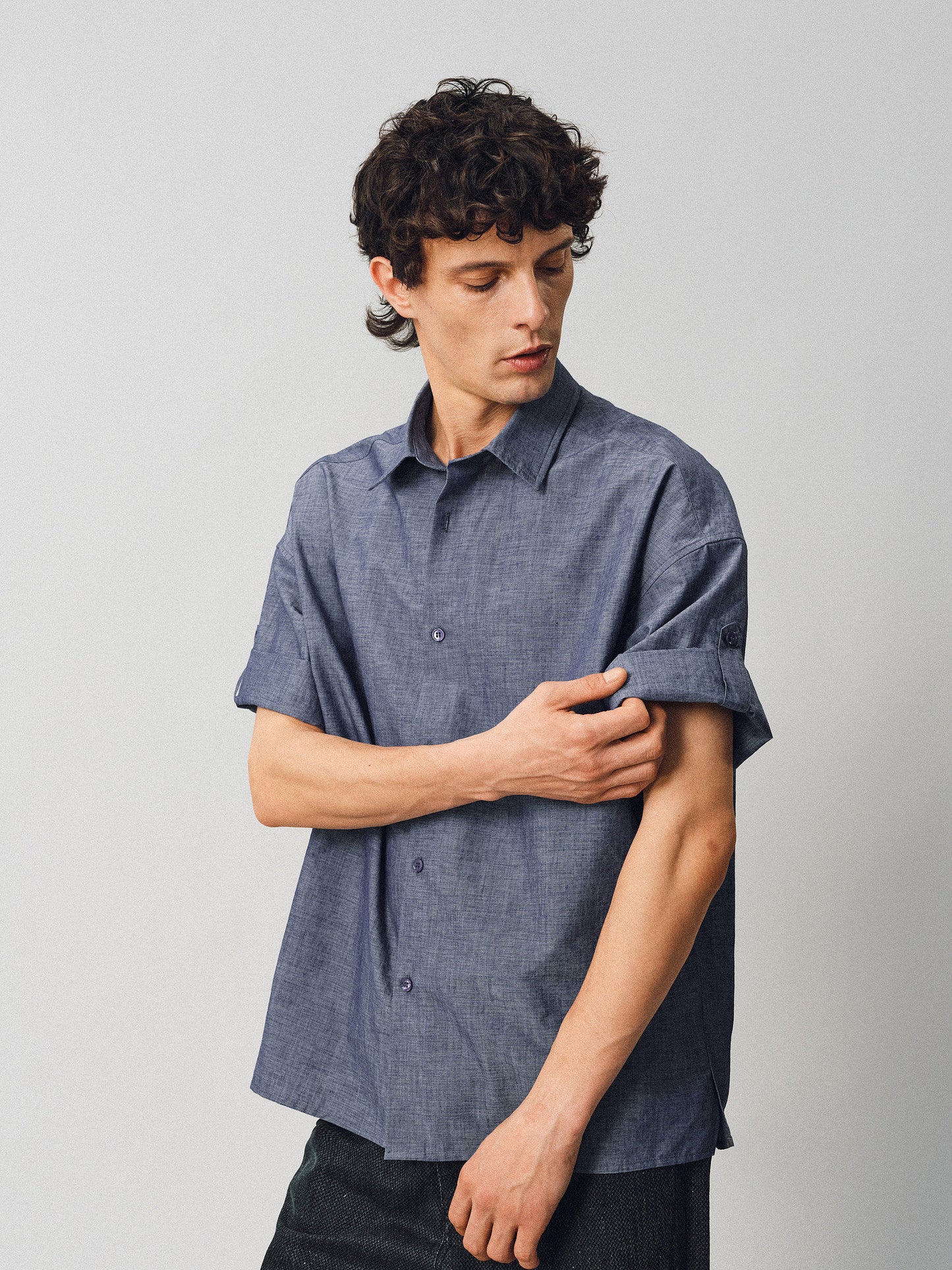 A relaxed-fit shirt with rolled sleeves