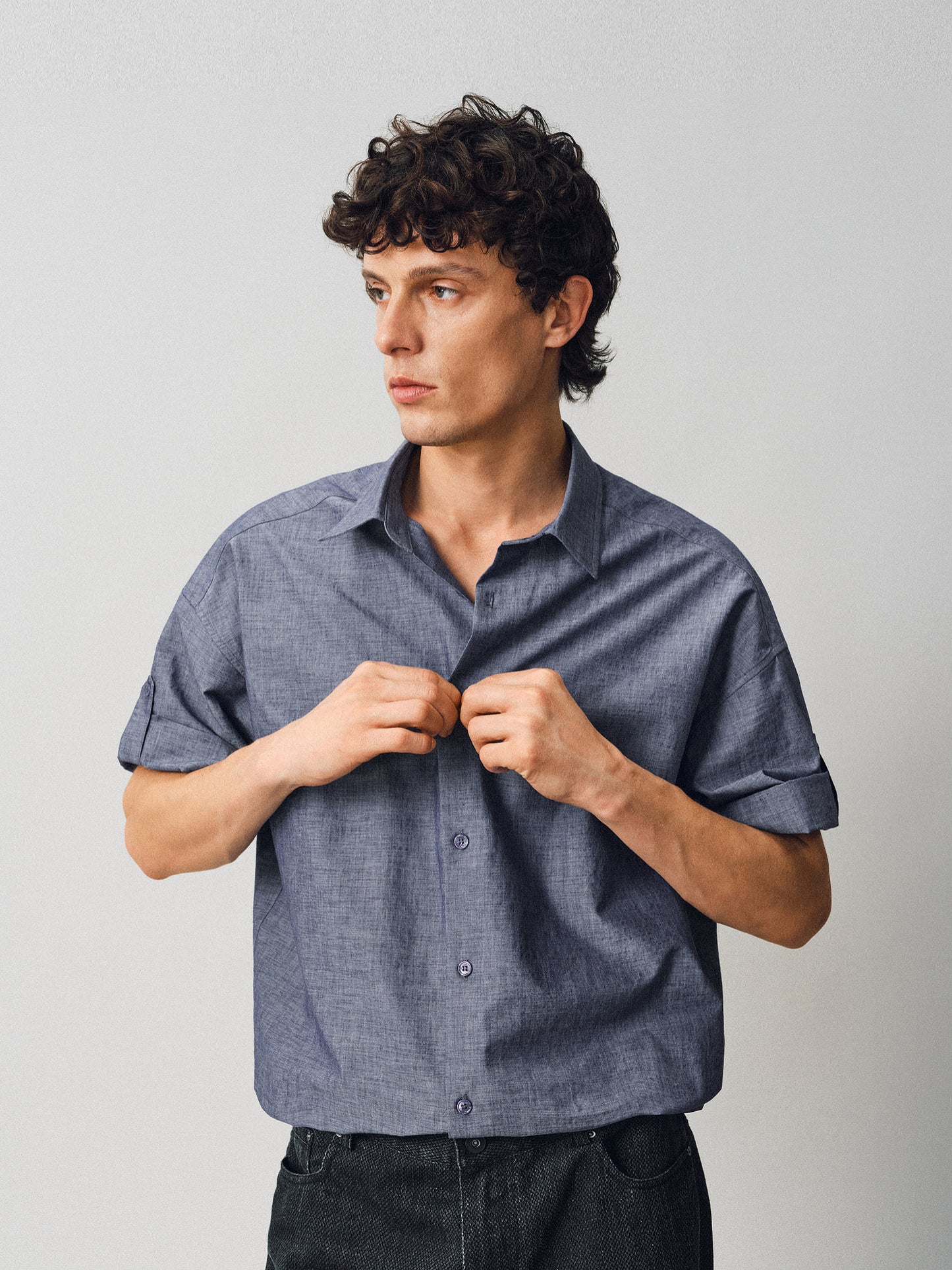 A relaxed-fit shirt with rolled sleeves