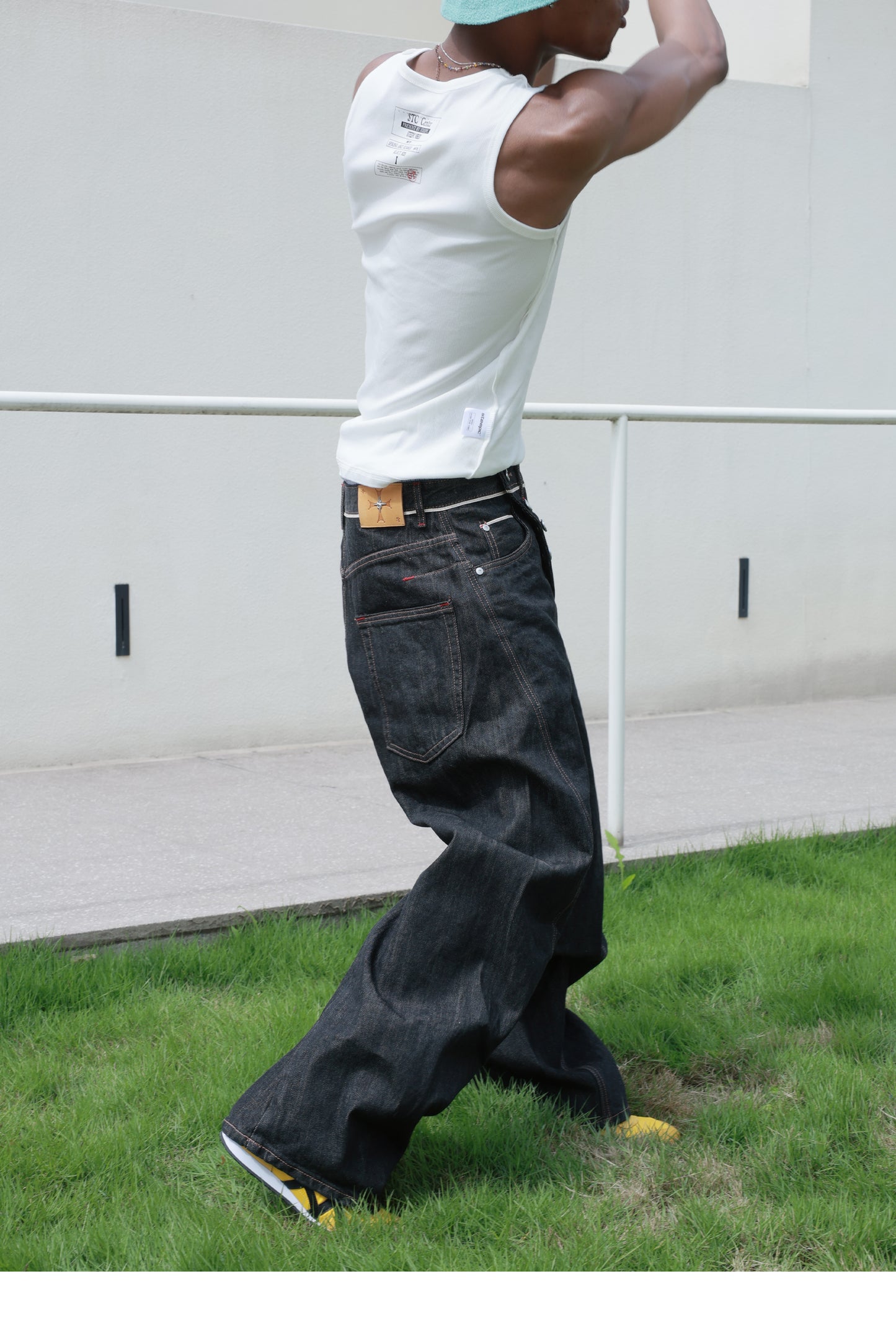 Denim pants with diagonal buckles