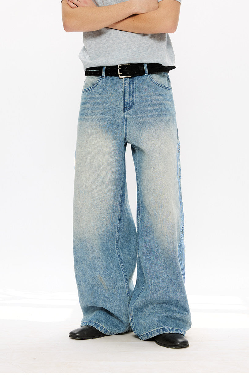 Vintage-style denim pants with totem embroidery