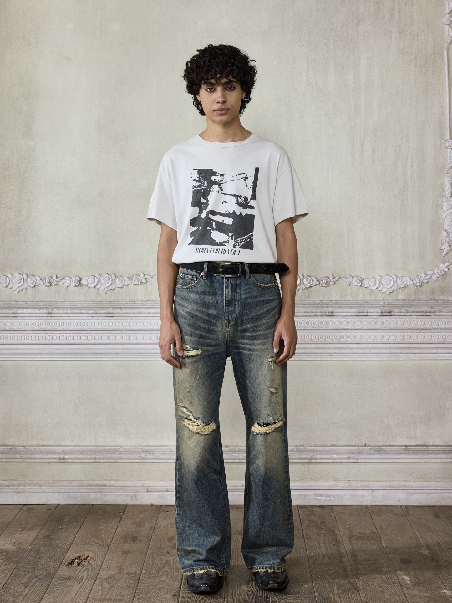 Distressed wash bootcut jeans