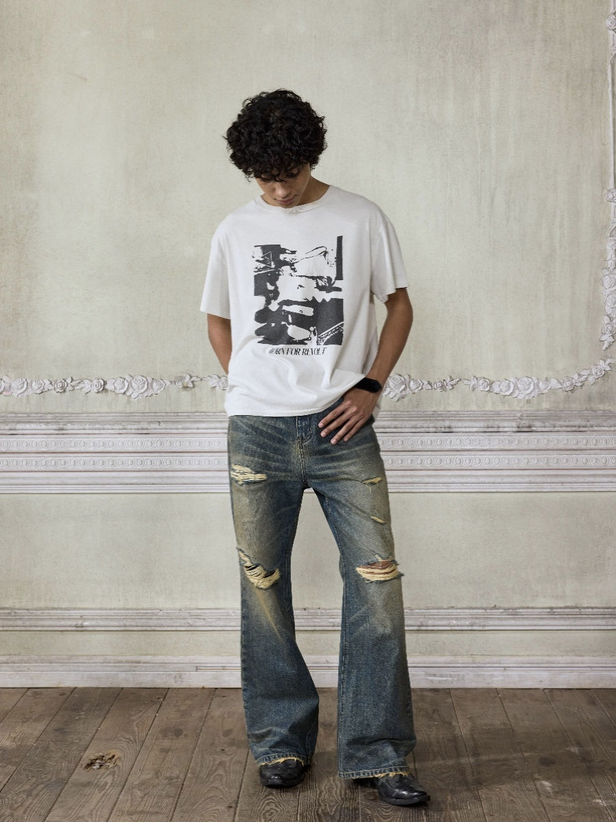 Distressed wash bootcut jeans