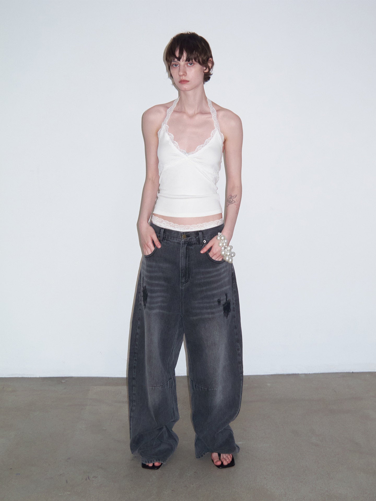 Distressed Patchwork Curved-Cut Denim Pants