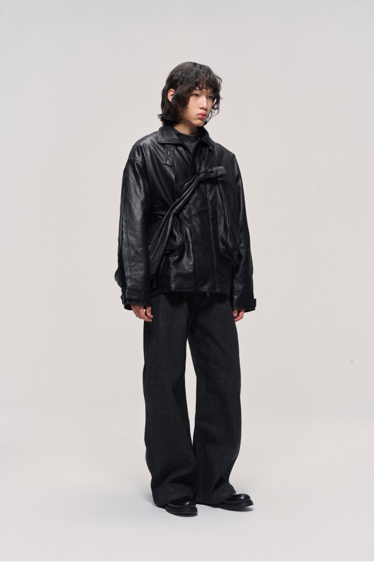 Damaged mid-length leather jacket