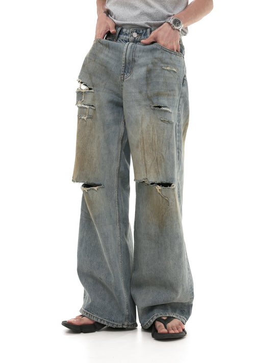 Mud-dyed Damaged Jeans