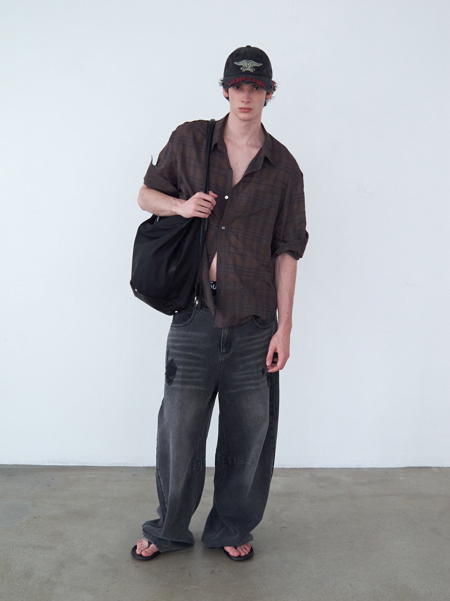 Distressed Patchwork Curved-Cut Denim Pants