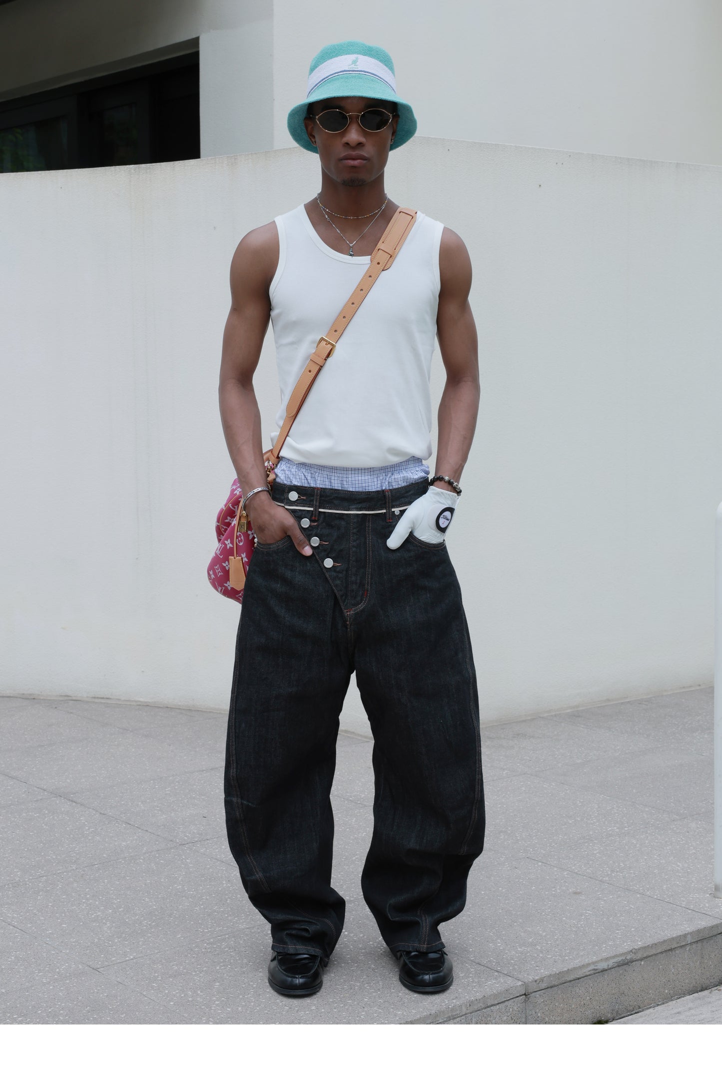 Denim pants with diagonal buckles