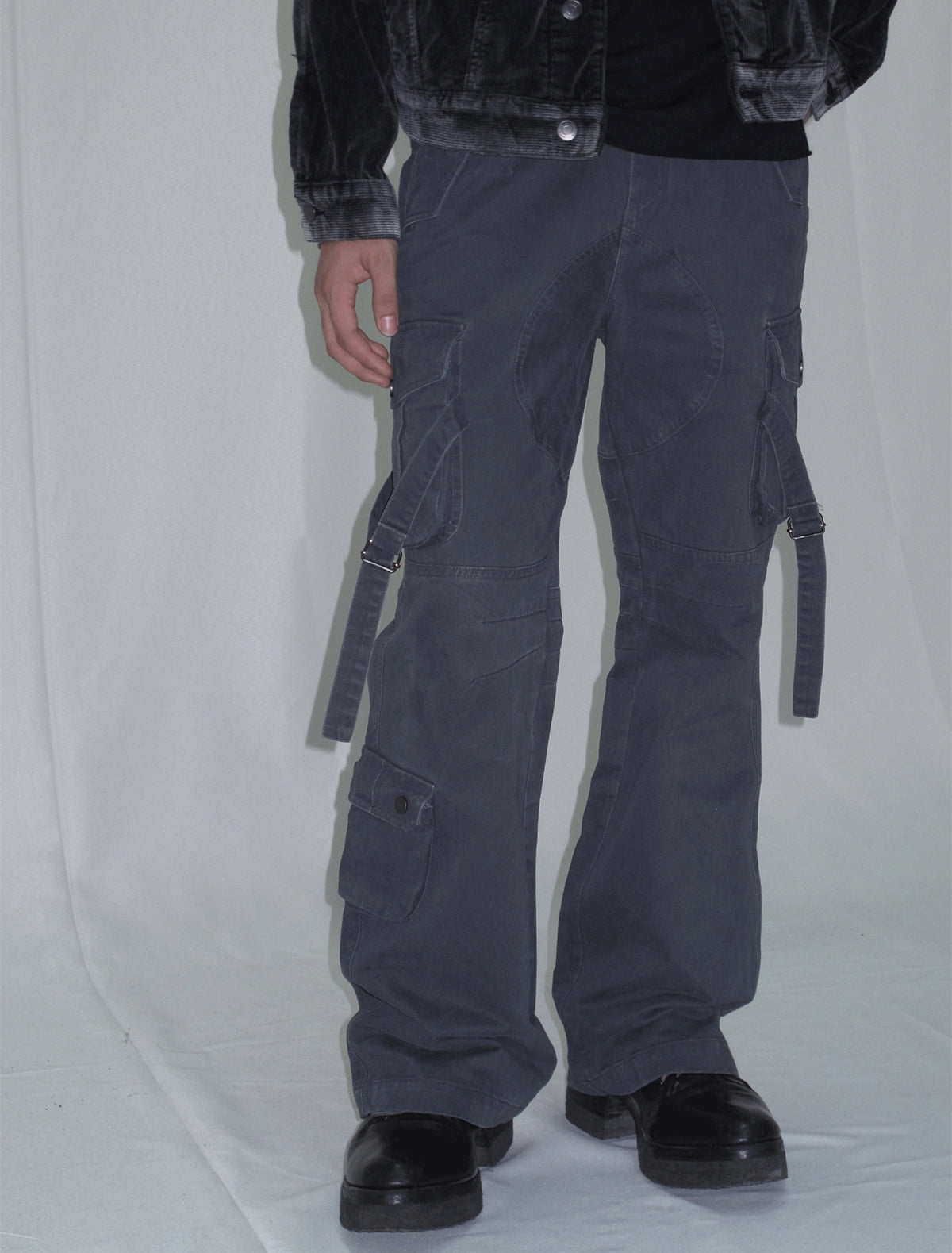 Cargo pants with multi-pocket straps