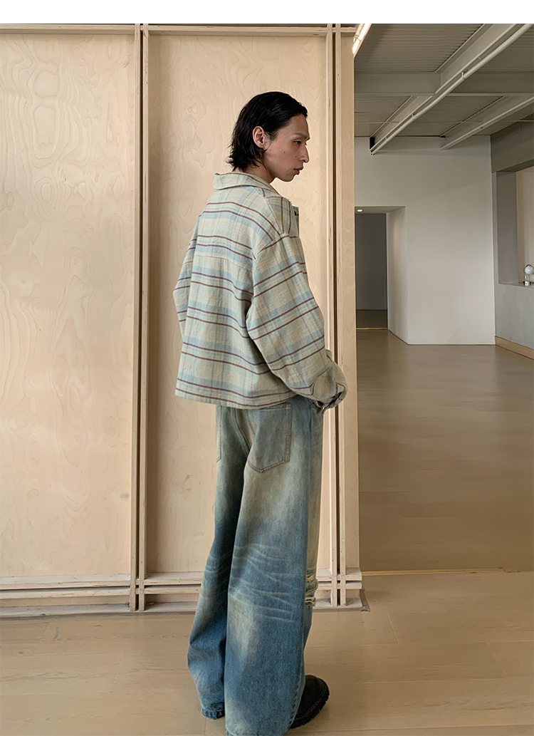 Mud-dyed wide-leg jeans