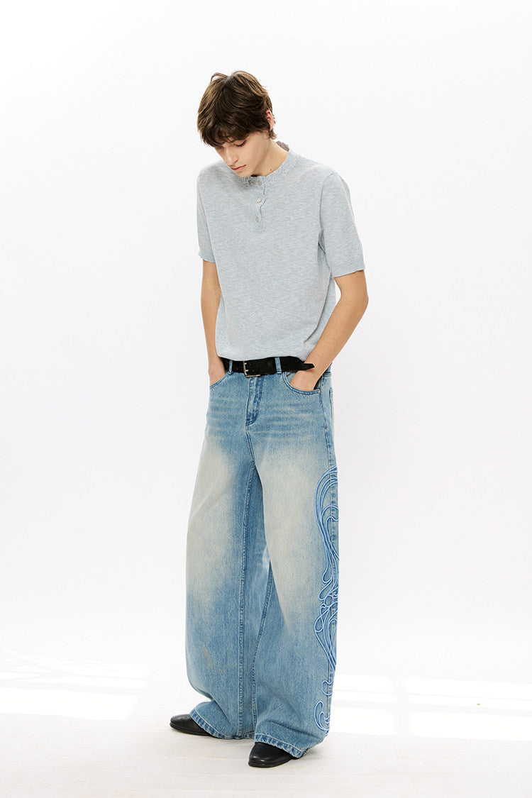 Vintage-style denim pants with totem embroidery