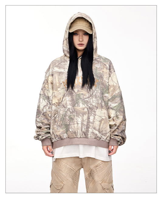 Hooded sweatshirt with camouflage branch pattern