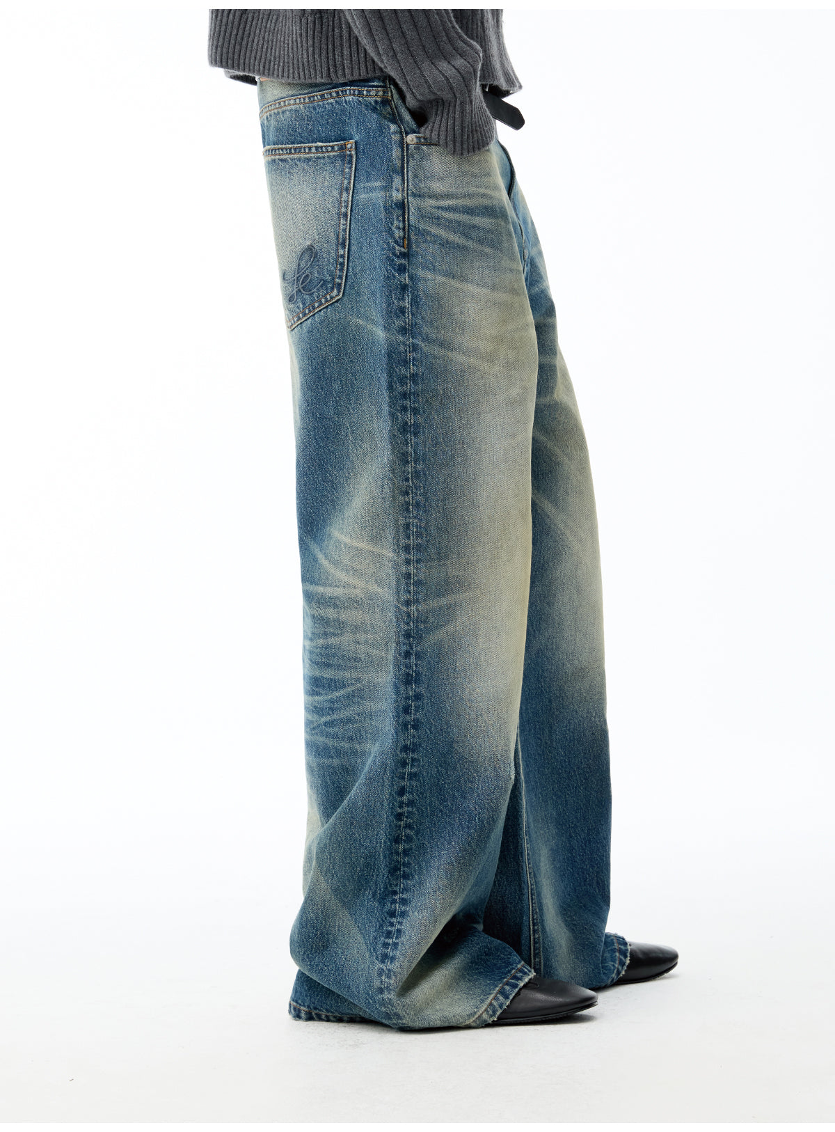 Whisker-washed denim jeans
