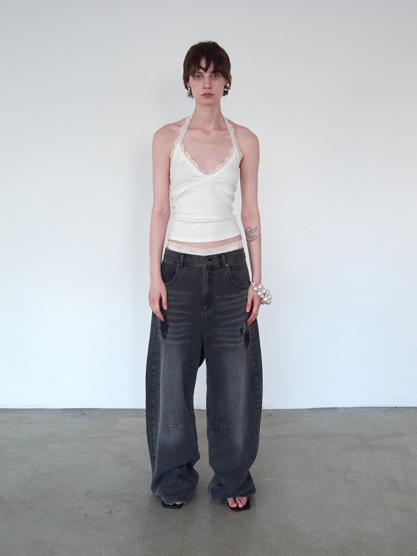 Distressed Patchwork Curved-Cut Denim Pants