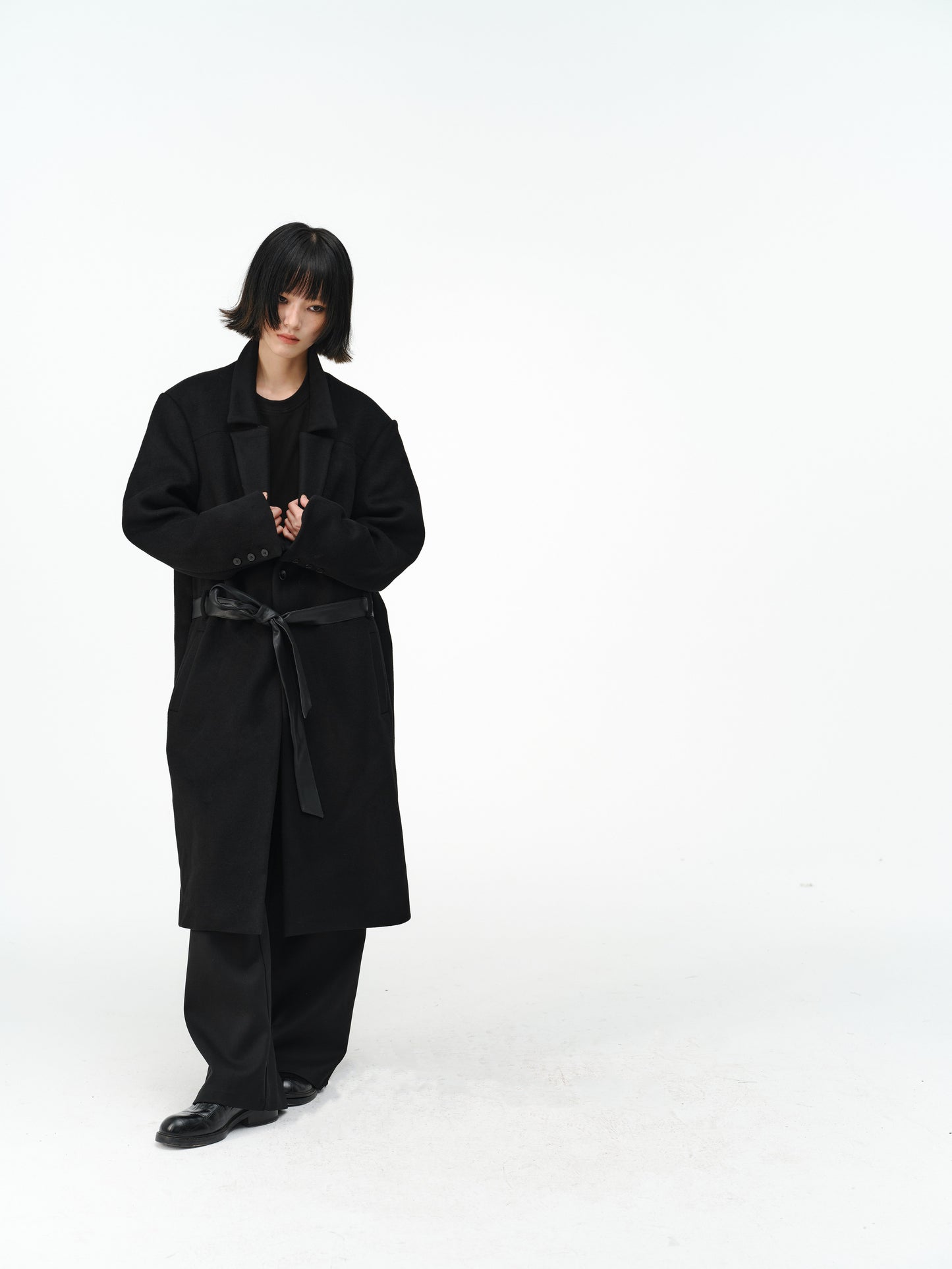 Overcoat with a leather belt