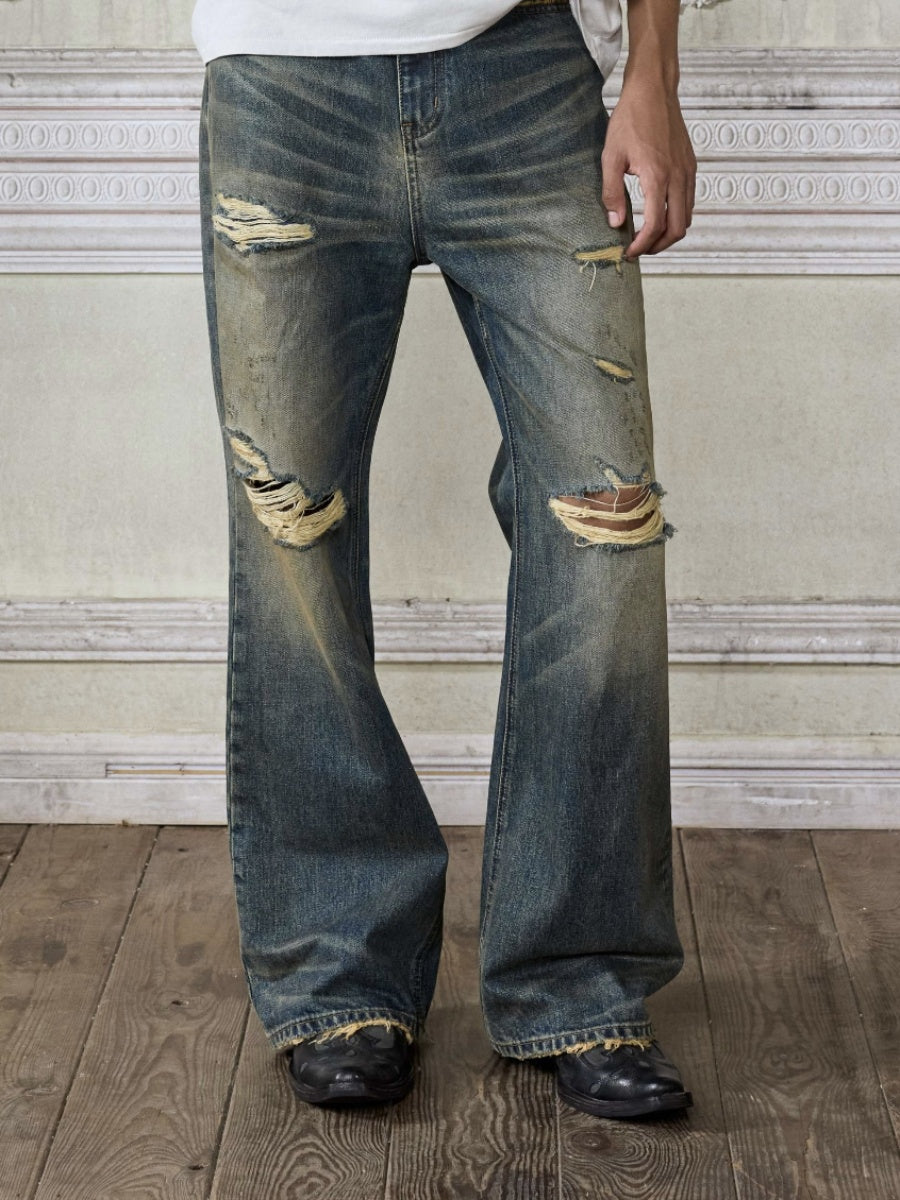 Distressed wash bootcut jeans