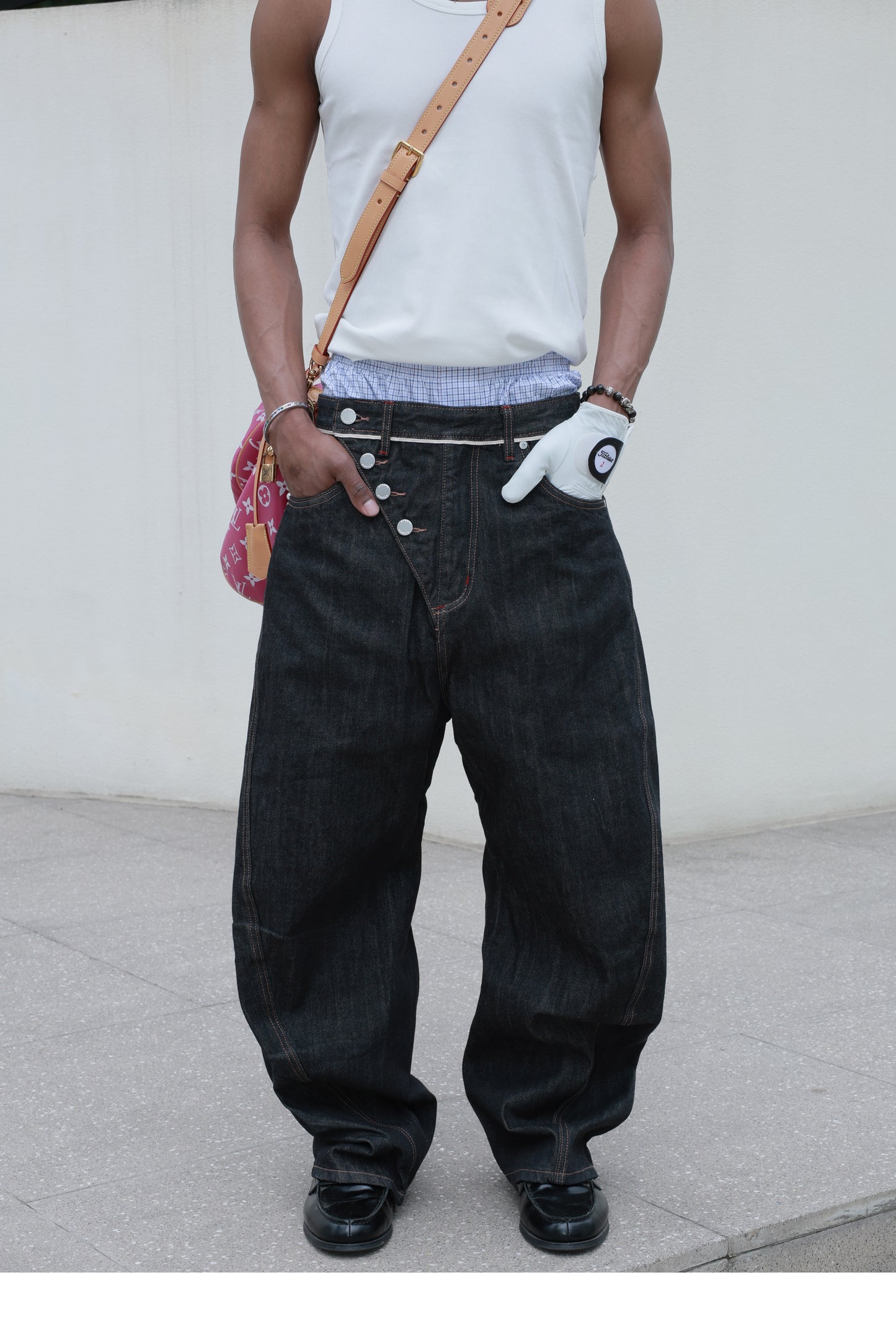 Denim pants with diagonal buckles