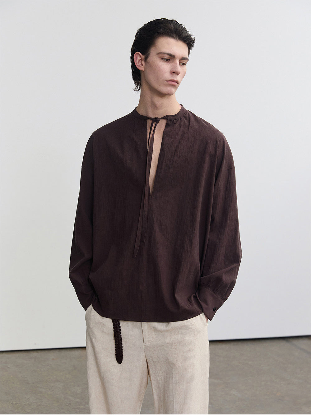 Half-open collar shirt with a ribbon