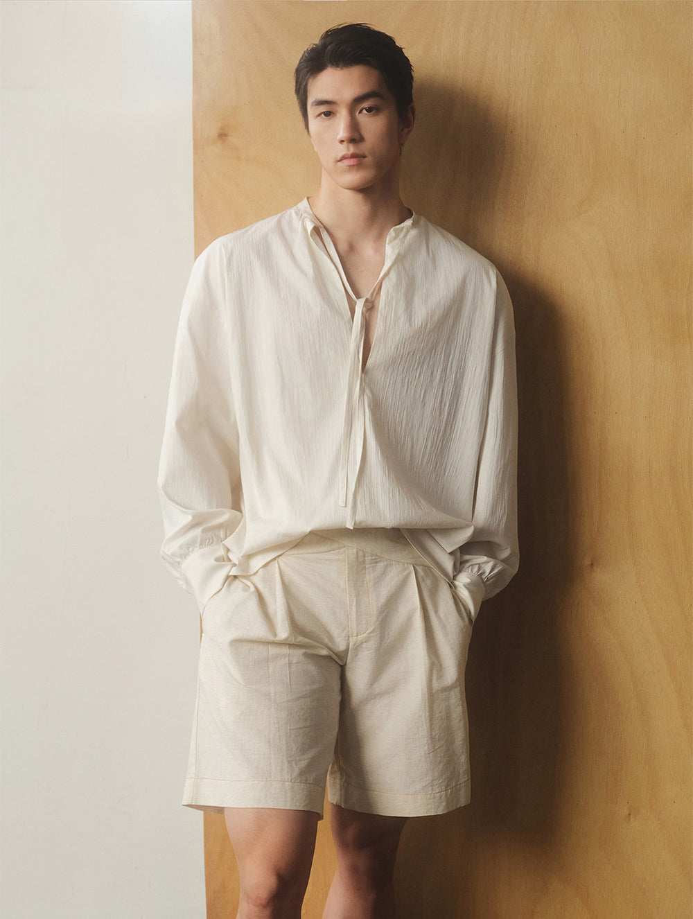 Half-open collar shirt with a ribbon