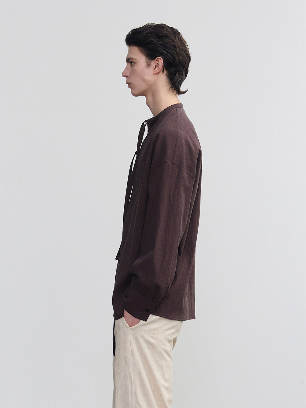 Half-open collar shirt with a ribbon