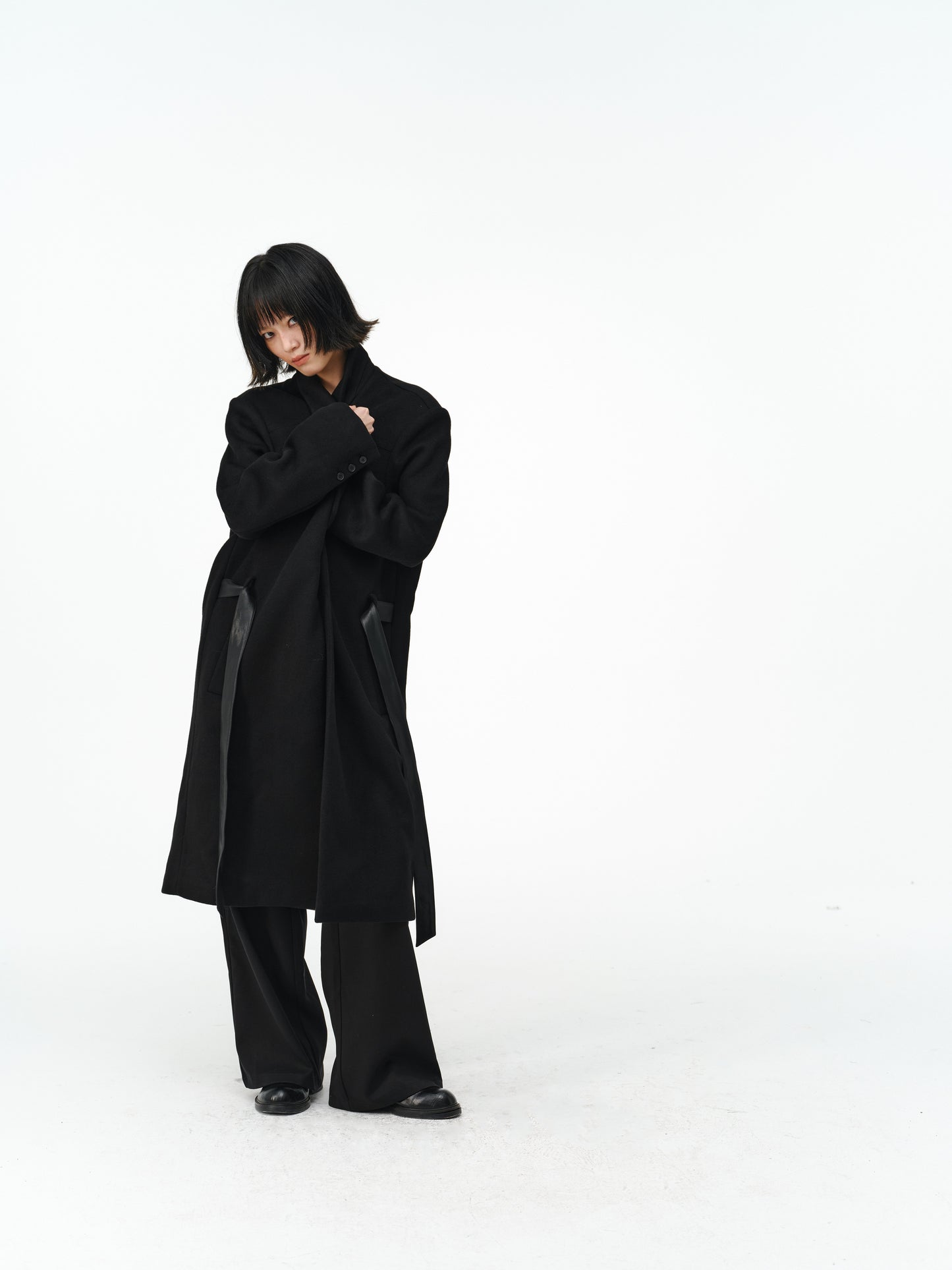 Overcoat with a leather belt