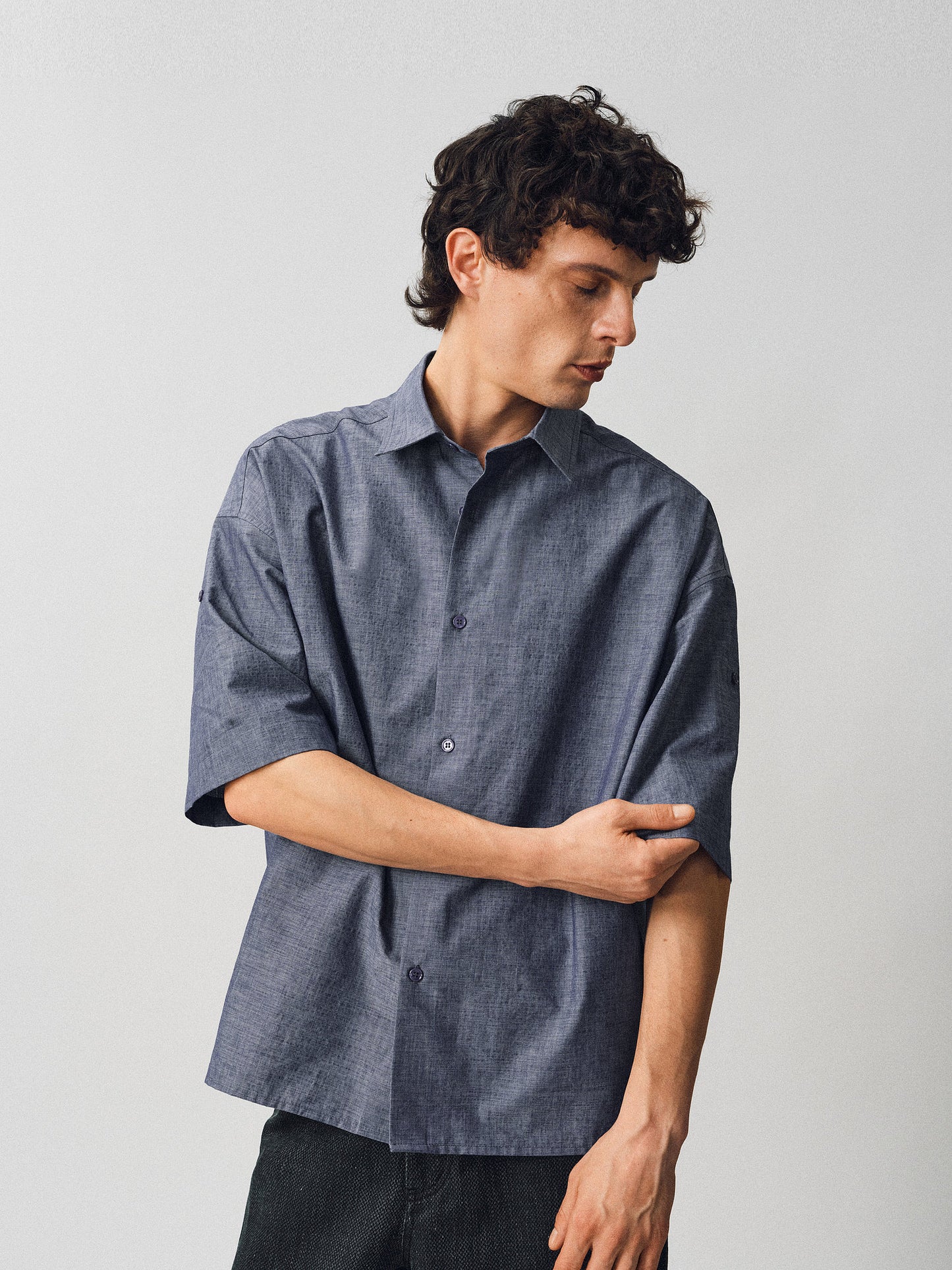 A relaxed-fit shirt with rolled sleeves