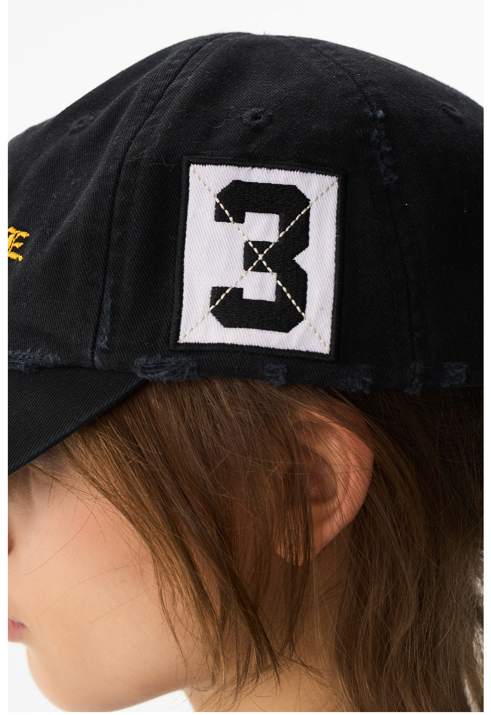 Wash-treated cap with embroidered patch