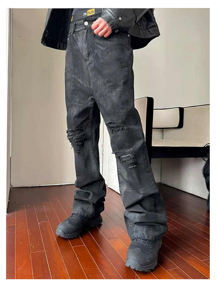 Damaged hand-coated denim pants