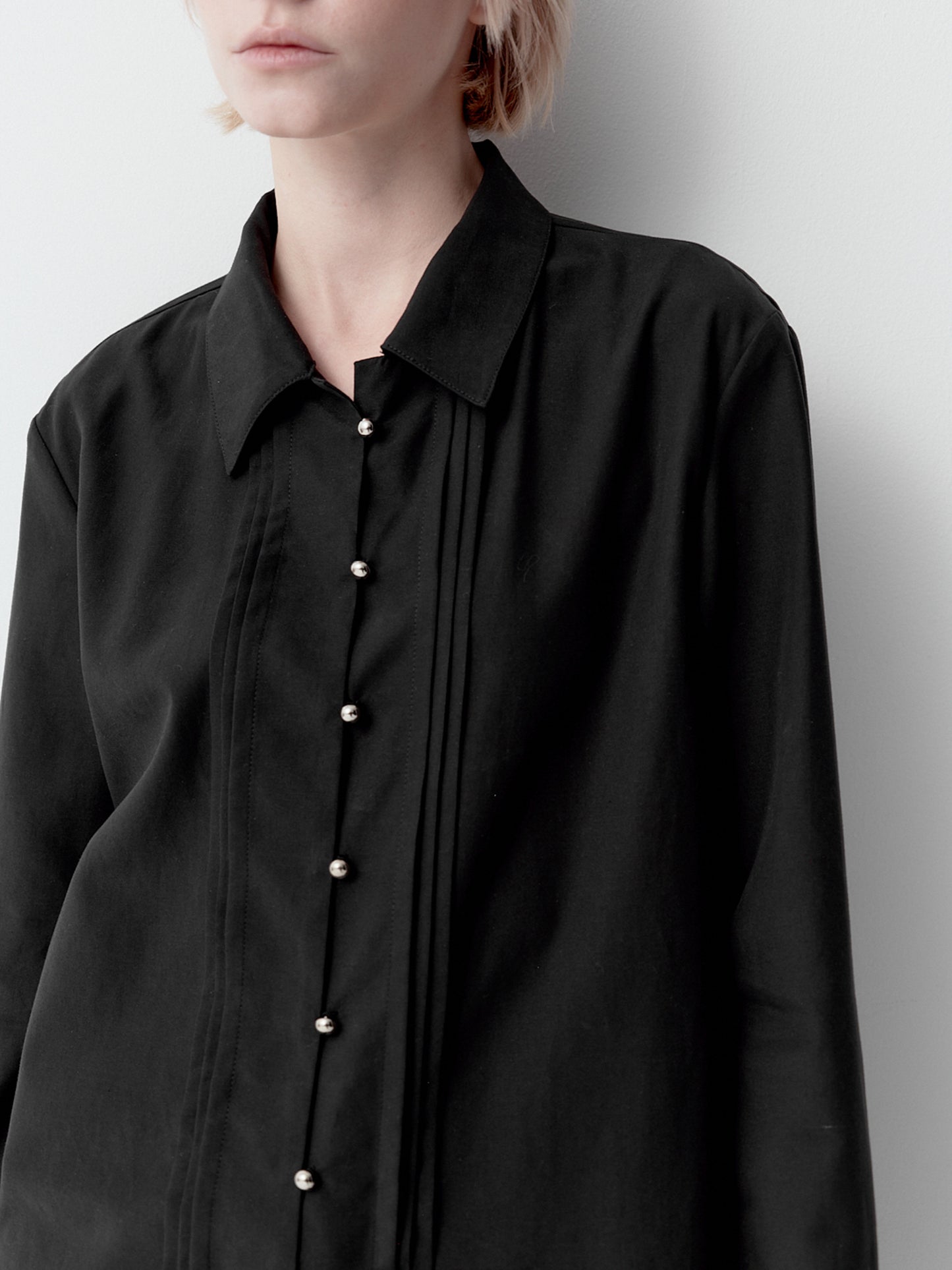 Shirt with metal buttons