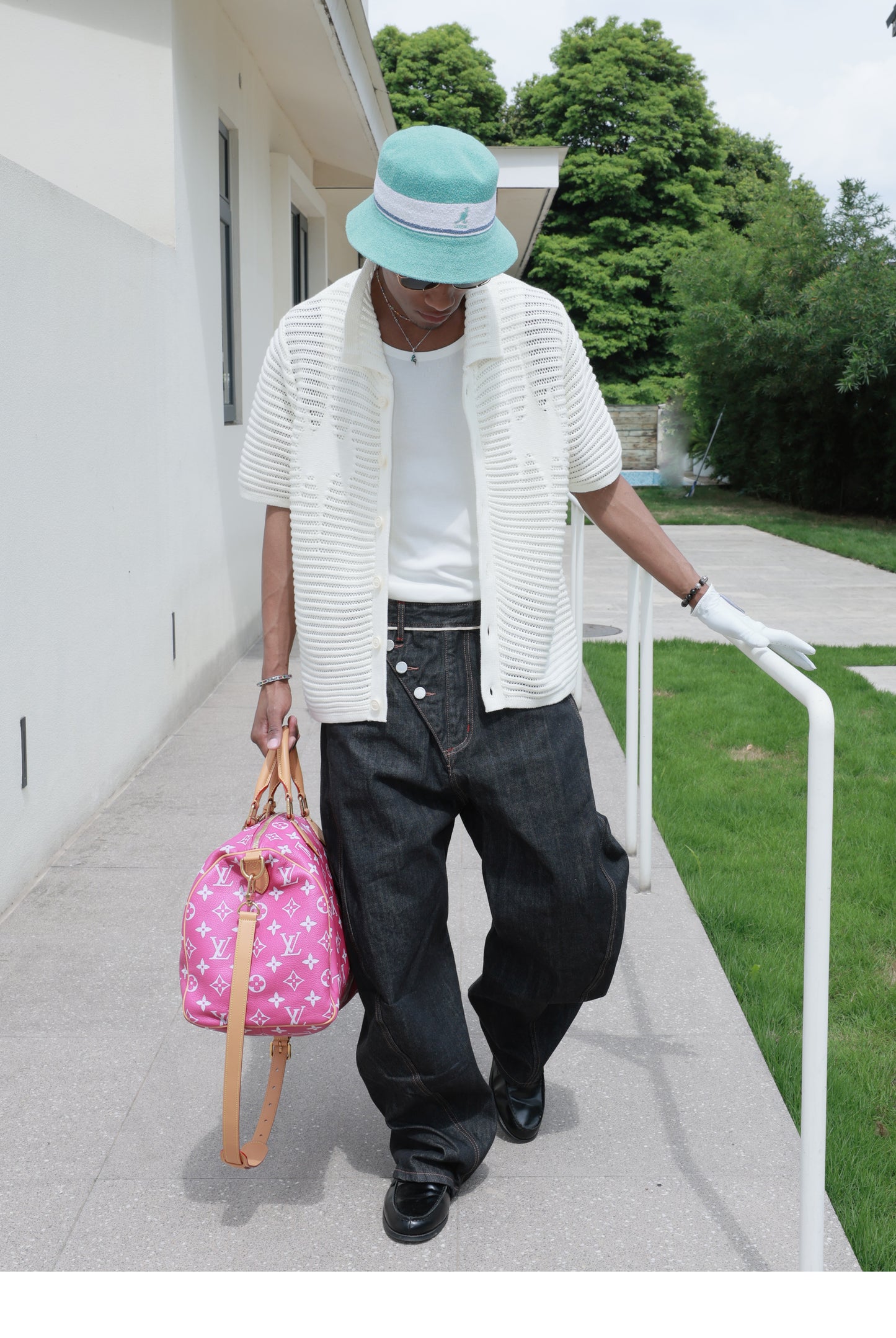 Denim pants with diagonal buckles