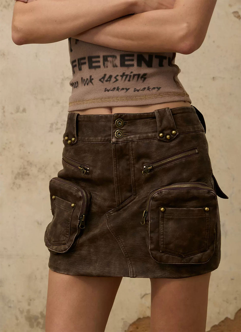 Damaged leather mini skirt