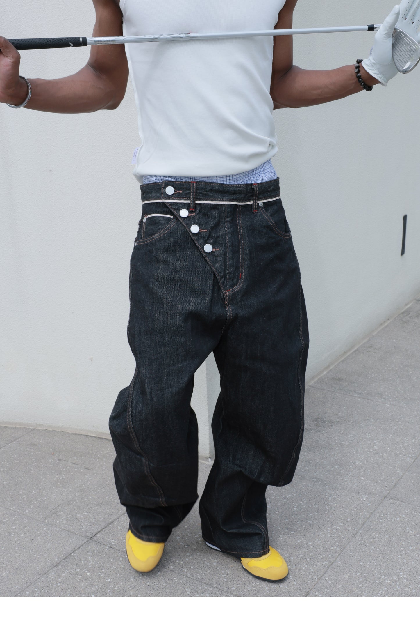 Denim pants with diagonal buckles