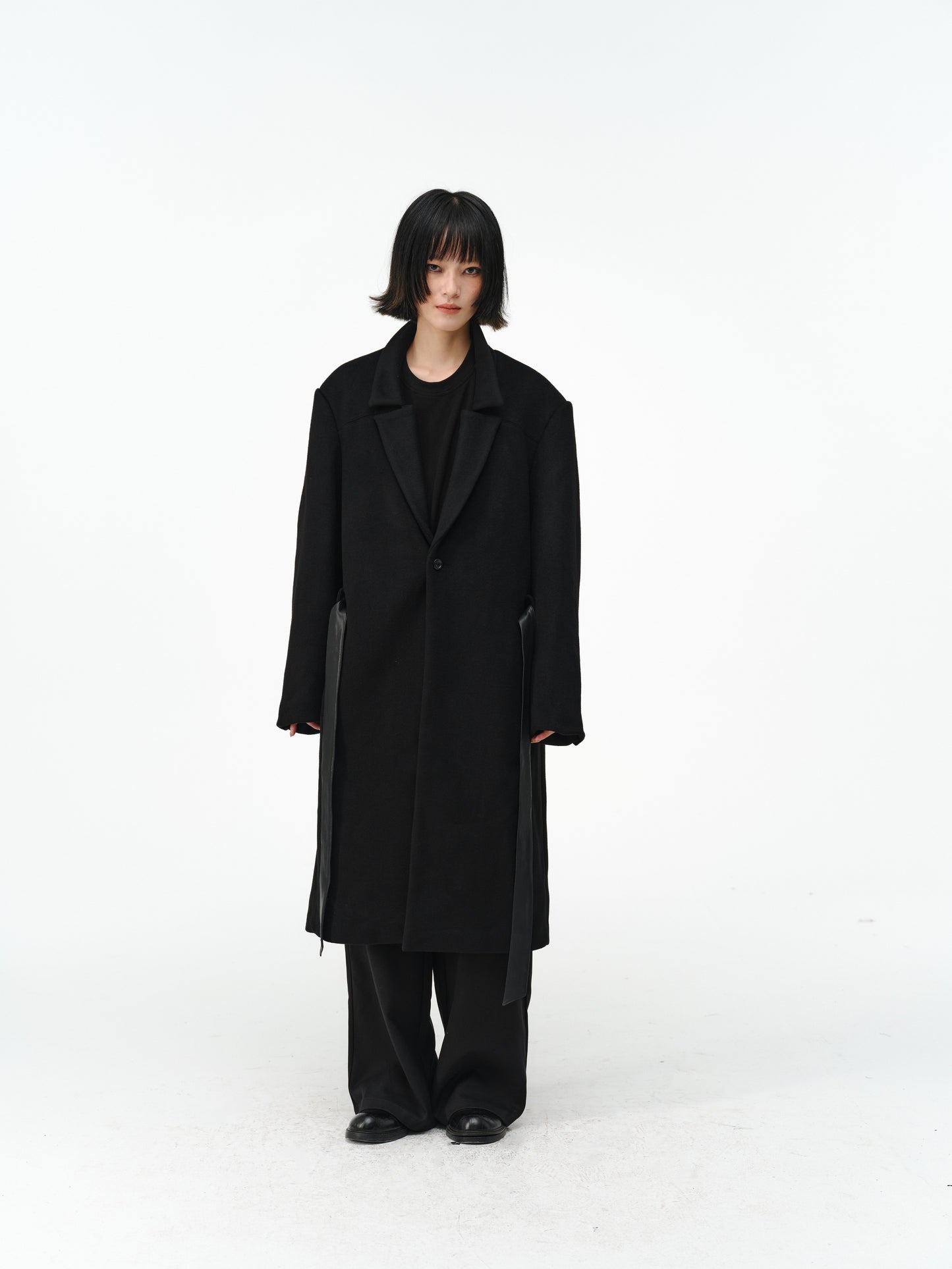 Overcoat with a leather belt