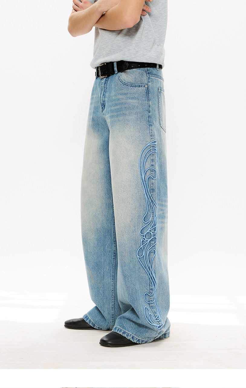 Vintage-style denim pants with totem embroidery
